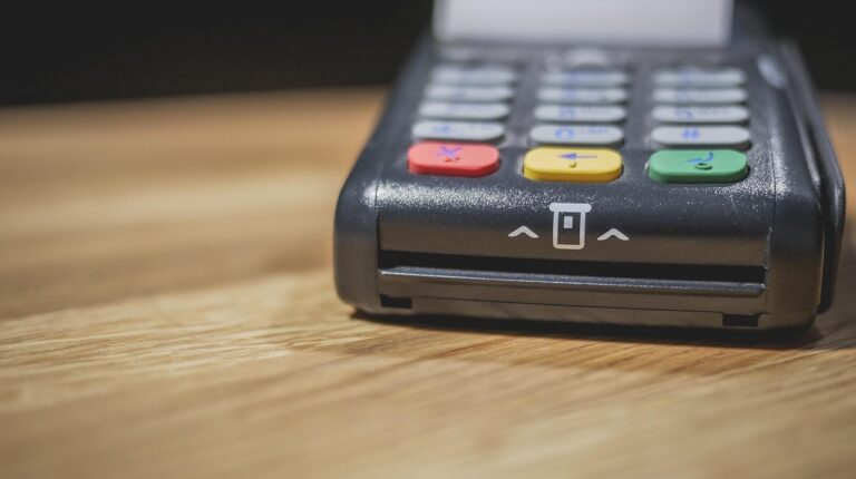 Customer using an on-site ATM inside a Delaware small business to complete a purchase